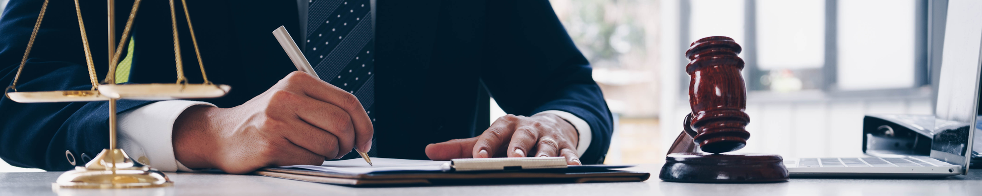 Attorney Writing at Desk